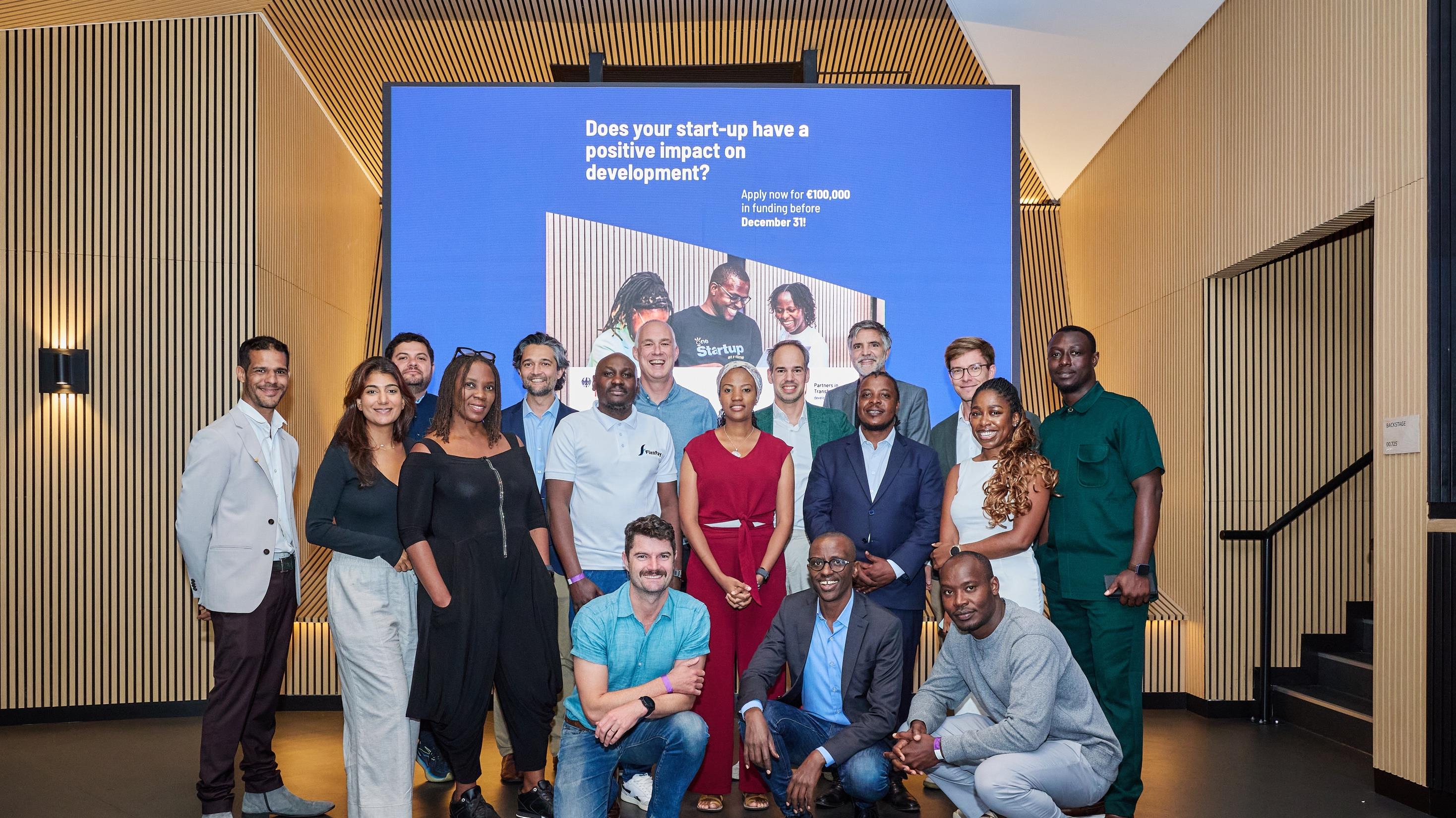 Investors and founders standing together after a private summit session