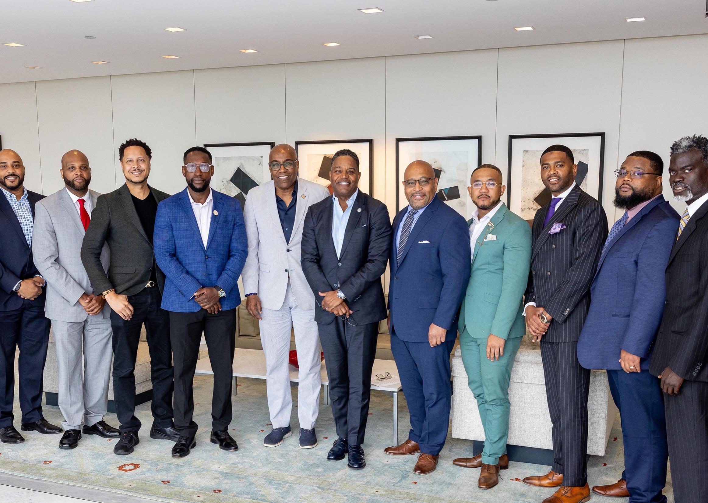 An investor delegation gathered in a private meeting room